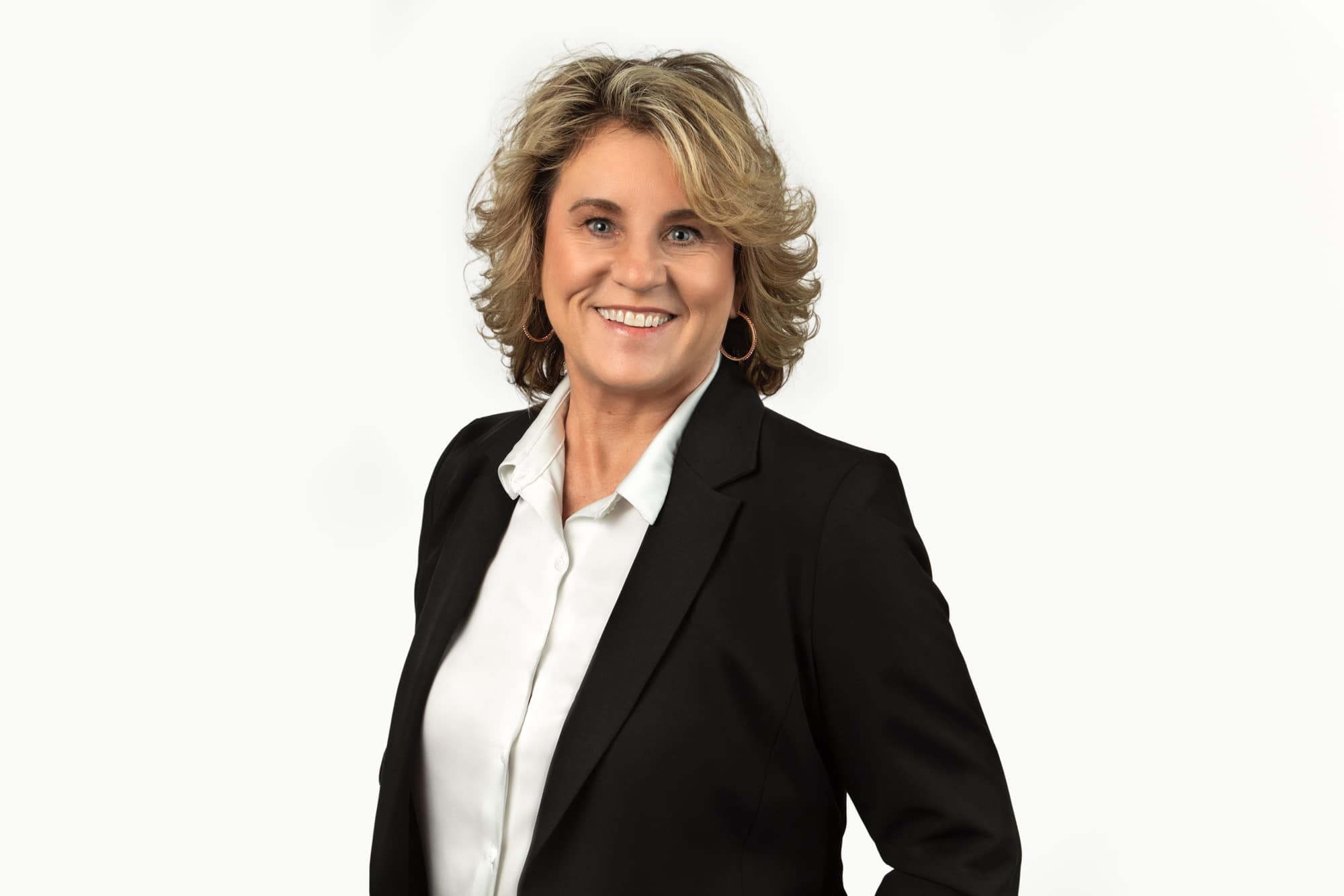 Jackie-Gonzalez_03152023_Low-Res-3 Jackie Gonzalez of ABC Bank in a black suit from Pikes Peak Pros Business Networking Group posing for a photo in Colorado Springs.