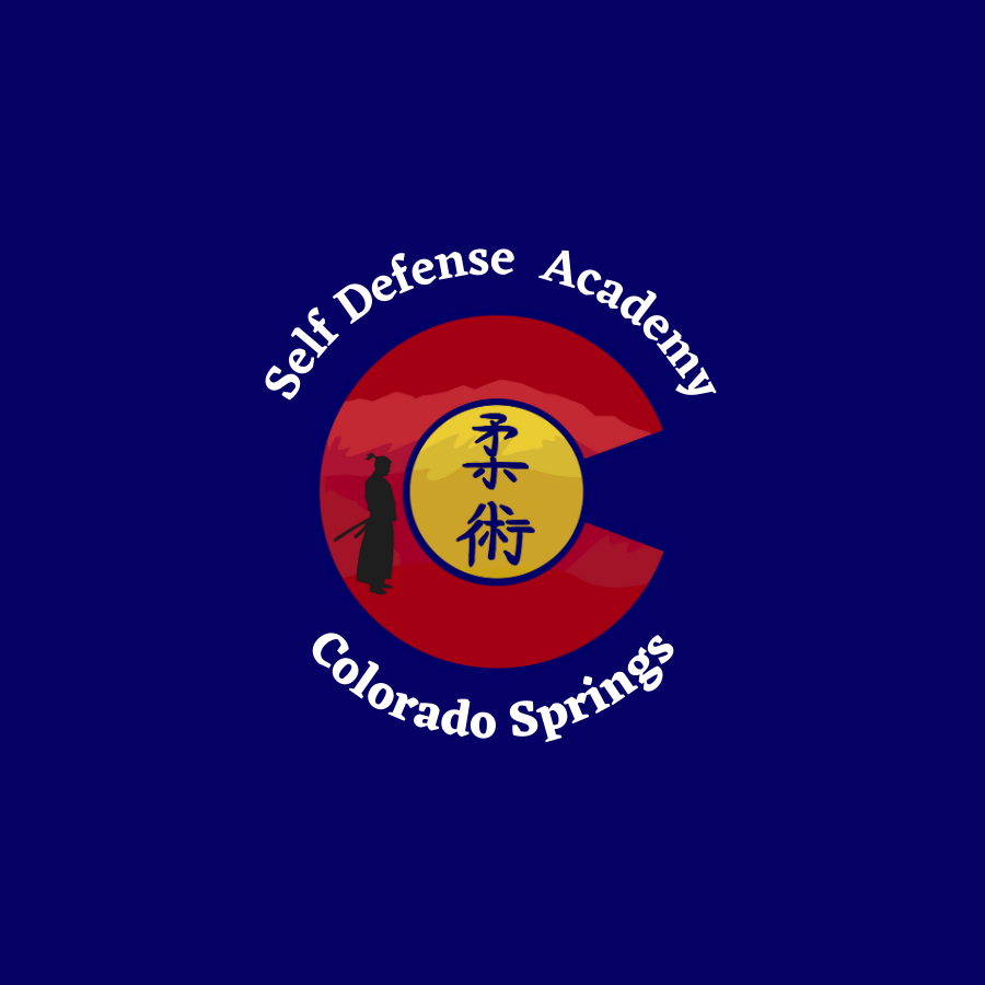 Logo of self defense academy, colorado springs, featuring a red circle, a yellow yin-yang symbol, and a silhouette of a martial artist.